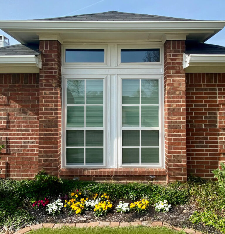 House with 2 double-hung and 2 awning windows