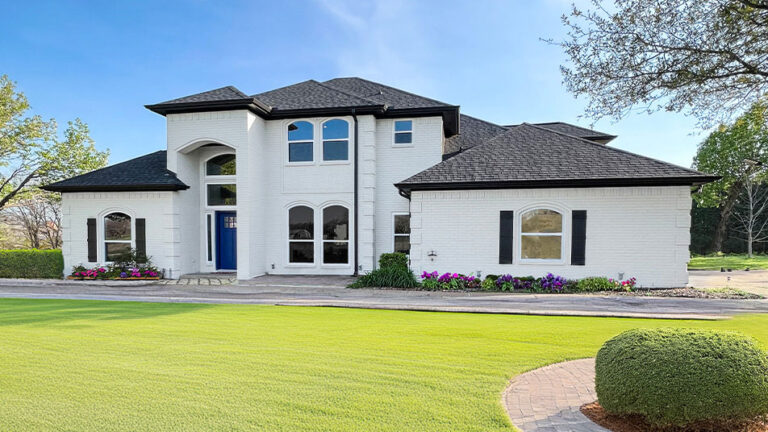 White two-story brick home exterior